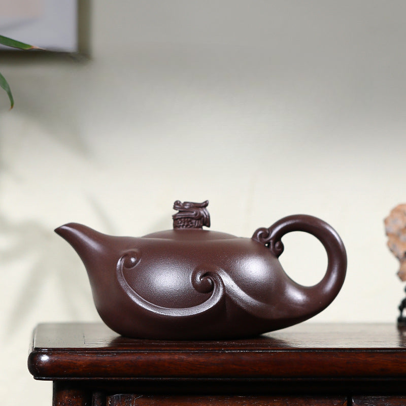 Handmade teapot with Chinese dragon on the lid