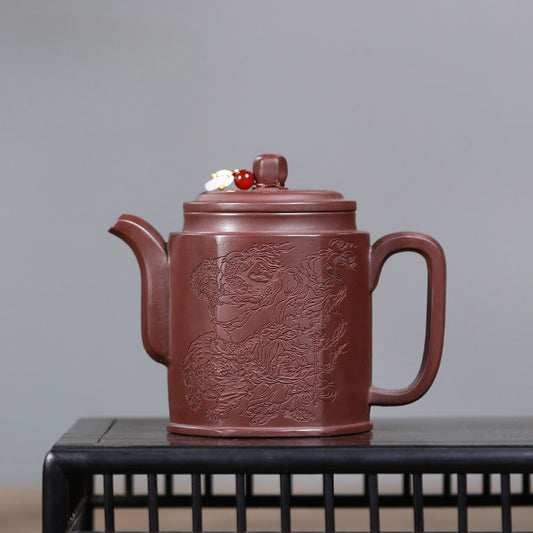 This is a teapot made by a famous Chinese master, with a hexagonal carving pattern.