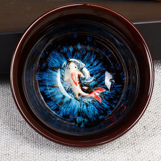 This is a Jianzhan, with a 3D goldfish image on the bottom of the bowl that looks lifelike