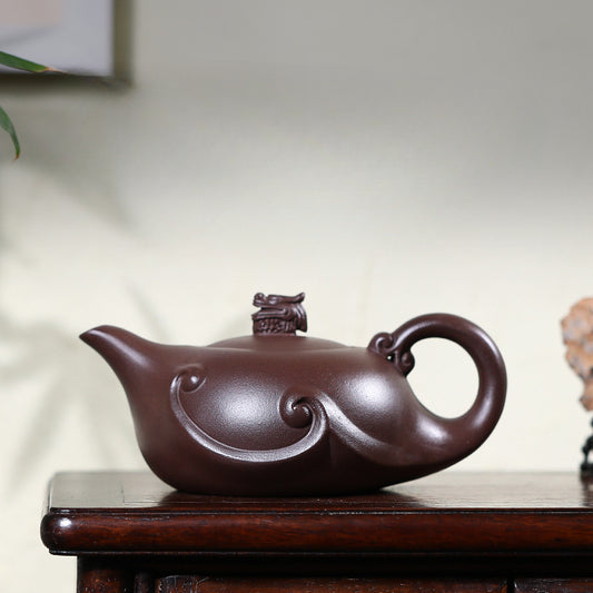 Handmade teapot with Chinese dragon on the lid