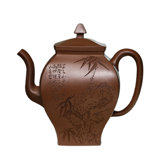 A purple clay teapot made by a famous Yixing artist, engraved with patterns