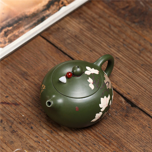 green printed teapot