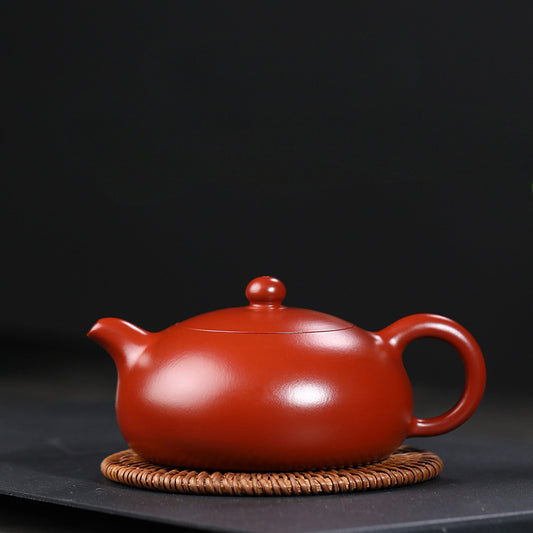 Half-moon shaped teapot