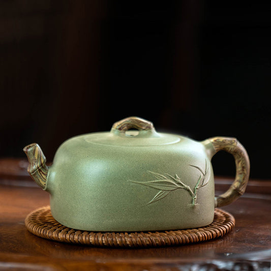 Carved bamboo leaves, all light green, the handle and spout are made of bamboo